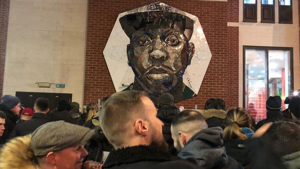 A mural of Edwards, commissioned in 2019, was the focal point for the gathering
