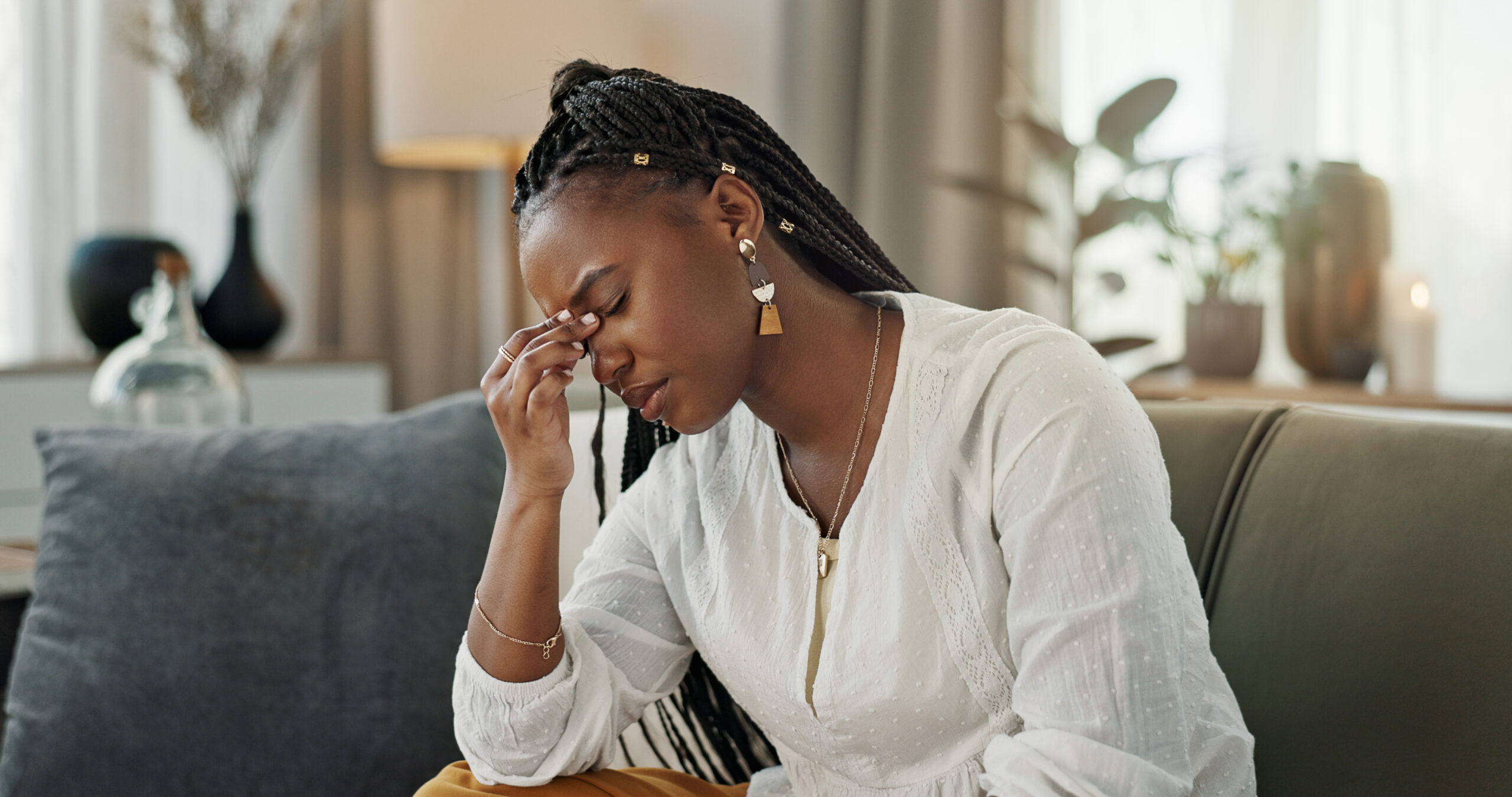 A lady in distress probably mourning a relative who has passed away and troubled about no finance to do the burial