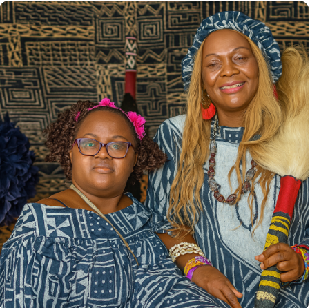 Alphonsine Djiako Leuga and her daughter Loraine Choulla pictured together in traditional African attire, honoring their heritage.