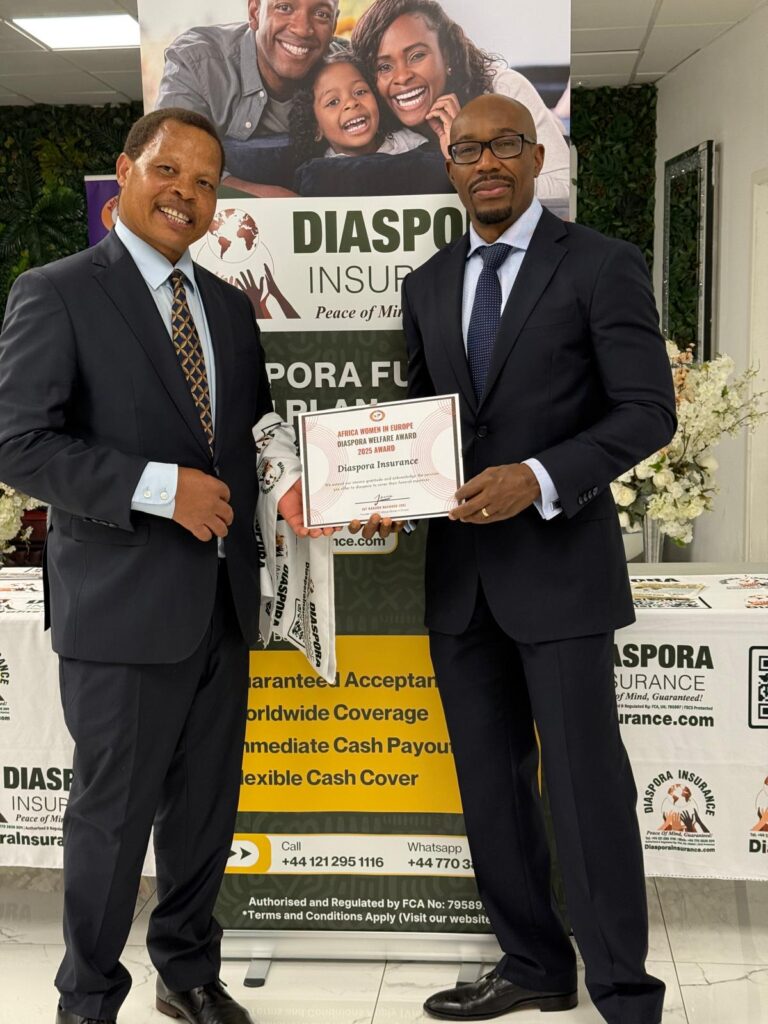 Dr. Sibert Mandega and the CEO of Diaspora Insurance proudly hold their AWE Diaspora Welfare Award 2025 certificate at the official presentation.