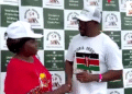 Dr. Sibert Mandega of Diaspora Insurance shakes hands with Maggie from BRIKEN Welfare Association at a community networking event, promoting funeral cover for Africans in the diaspora