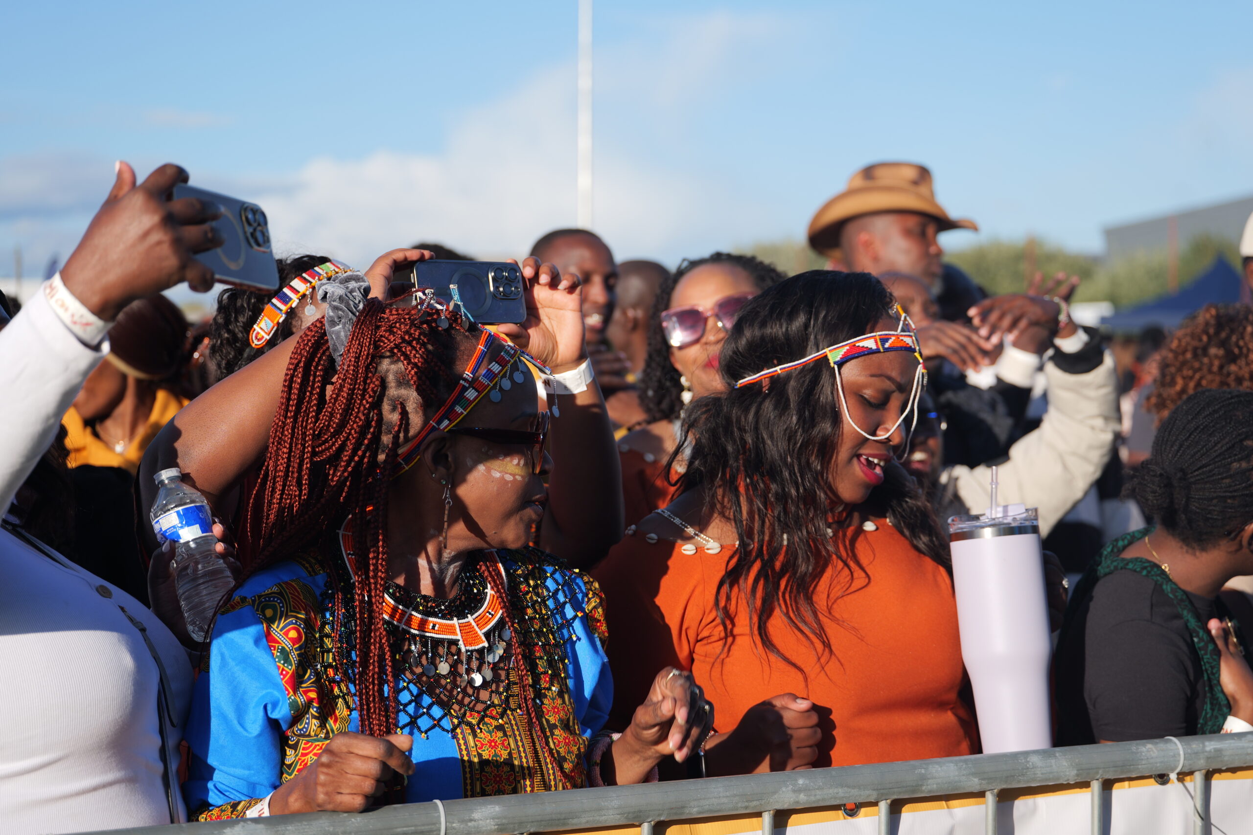 Women in traditional attire dancing and celebrating at Ngemi Cia UK Homecoming Festival 2025, a joyful event highlighting culture and Diaspora Insurance support.