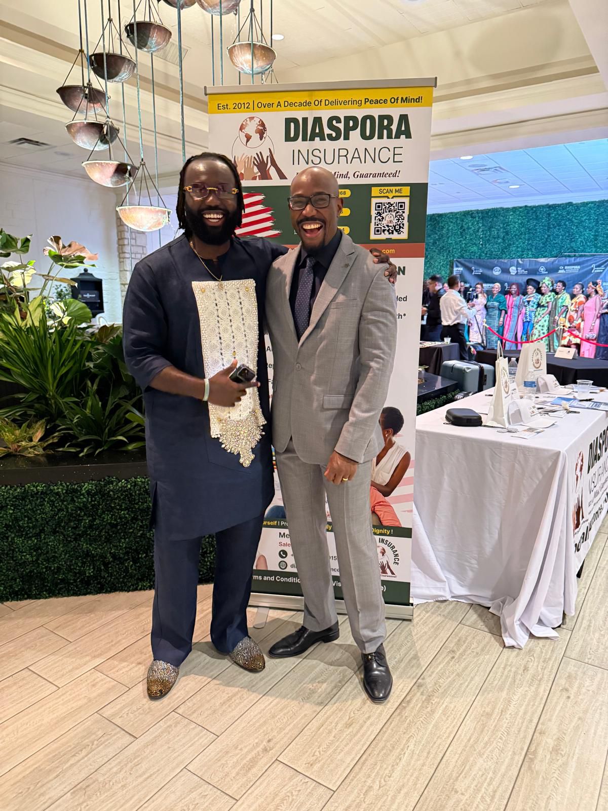 Dr. Mandenga of Diaspora Insurance engaging with African diaspora members at the Ubuntu Gala in the United States.