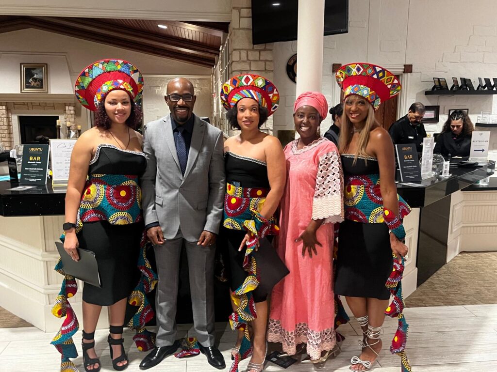 A cheerful Dr. Sibert Mandenga of Diaspora Insurance engages with guests during the Ubuntu Gala in the US