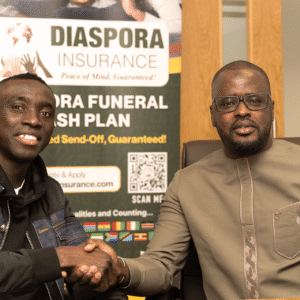 api Ciss&eacute; posing for a photograph in the Diaspora Insurance boardroom alongside Manchester-based Senegalese community leader Papr Ngor Thiar&eacute;.