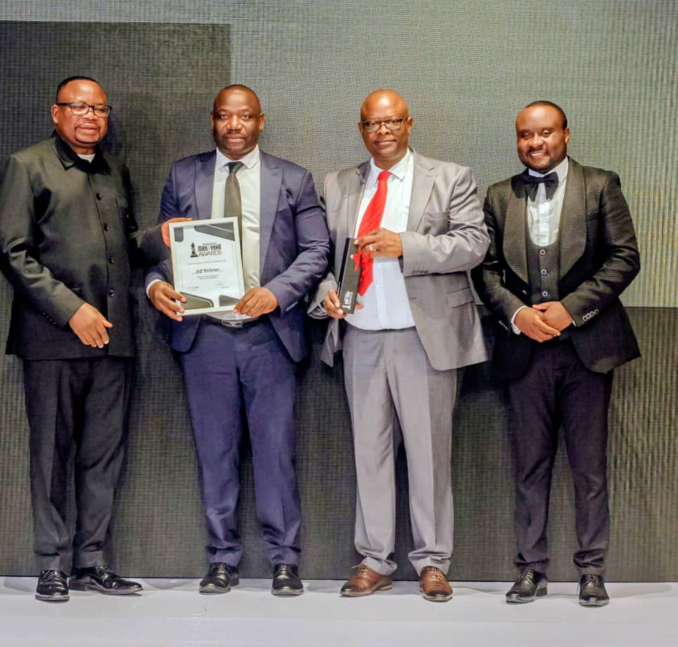 Lovemore Nyausaru receiving the Diaspora Man of the Year in Entrepreneurship award on behalf of Jeff Madzingo at the Zimbabwe Men of the Year Awards ceremony.