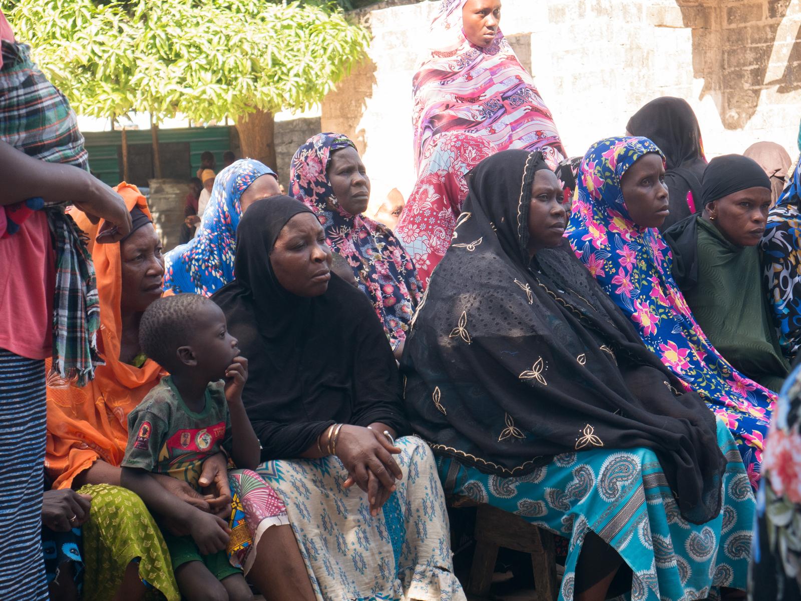 Women receiving bags of rice donated by Diaspora Insurance in Brikama Manduar, The Gambia.