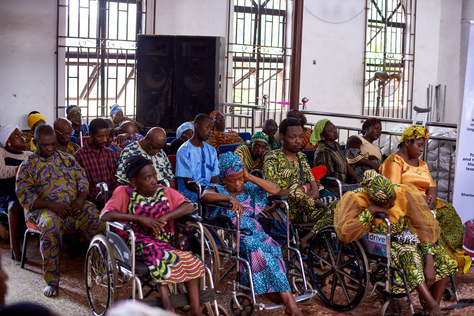 Women with disabilities benefiting from food donations and essential items through the Diaspora Insurance Giving Back Initiative in Nigeria..